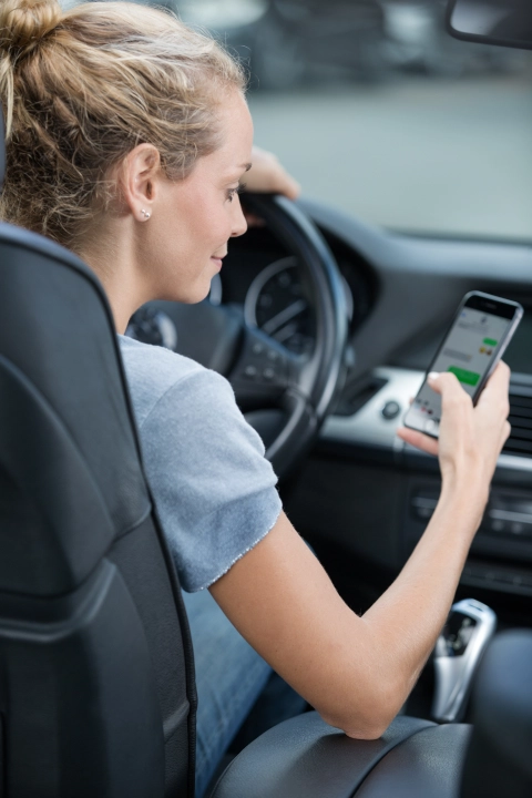 Driver using a phone behind the wheel.